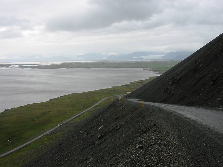 Sept 1, 2001 - Along Rt.1 near road to Hfn.<br />View along the coast towards a tongue of Vatnajkull (Water Glacier) The largest glacier in Europe.