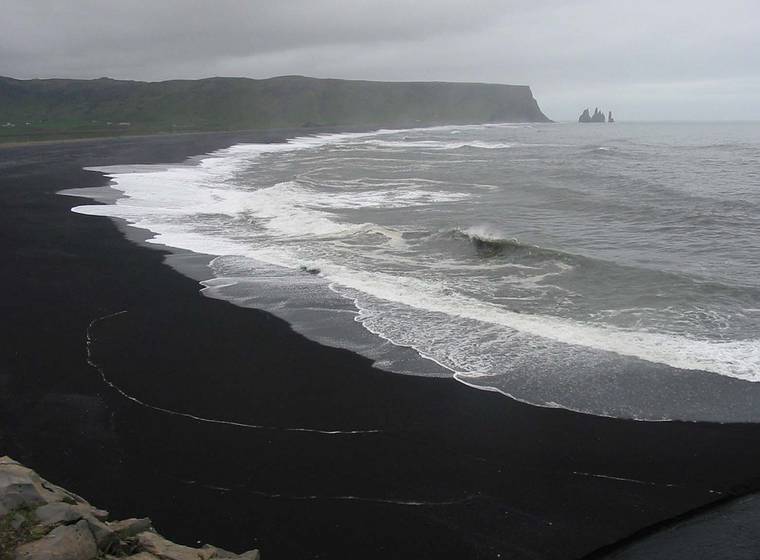 Sept 2, 2001 - Dyrhlaey, Iceland.<br />Black beach and the Reynisdrangur sea stacks.