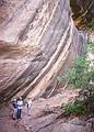 May 16, 2001 - Natural Bridges National Monument, Utah.<br />Joyce, Ronnie, and Baiba on trail under overhanging rock to Sipapu Bridge.