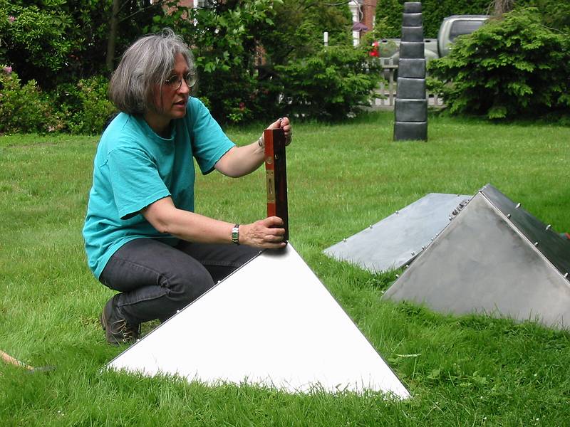 June 17, 2002 - Moses-Kent House Museum, Exeter, New Hampshire.<br />Outdoor sculpture exhibit.<br />Joyce installing her sculpture "Kinetic Forces Uplifted".