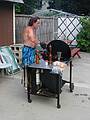 July 1, 2002 - At Marie's in Lawrence, Massachusetts.<br />Paul cooking on his grill at poolside.