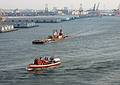 July 4, 2002 - New York, New York.<br />Macy's fireworks barge approaching the Brooklyn Bridge as it heads up the East River.