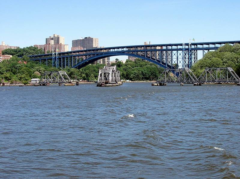July 5, 2002 - New York, New York.<br />The blue Henry Hudson Bridge connecting the Bronx and Manhattan<br />and the open railroad bridge at the northern tip of Manhattan.