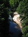 July 11, 2002 - Saratoga Springs, New York.<br />Geyser Brook with mineral deposits along its bank from a mineral spring<br />seen from the bridge entering the Arts Center.