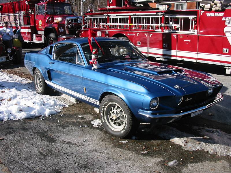 Dec 1, 2002 - Merrimac, Massachusetts.<br />Santa Parade participants gathering before the parade.<br />A 1960s Ford Mustang.
