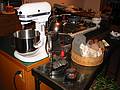 Dec 12, 2002 - Merrimac, Massachusetts.<br />Joyce's metal sculpture, a small teapot, rocks collected mainly in Iceland<br />all on Joyce's steel table (the Kitchen Aid mixer just happens to be there).