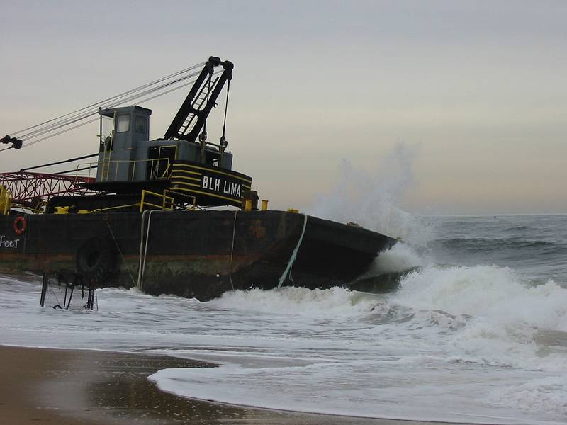 Dec 13, 2002 - Plum Island, Massachusetts.<br />Barge and its tugboat which were beeched the evening of Dec 11<br />after the tug boat lost control of the barge in the mouth of the Marrimac River.