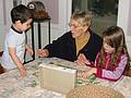 Dec 24, 2002 - Merrimac, Massachusetts.<br />Gujn, Benna, and Dagbjrt doing a jigsaw puzzle at the dining room table.