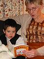 Dec 25, 2002 - Merrimac, Massachusetts.<br />Gujn being read to by his grandmother Benna.