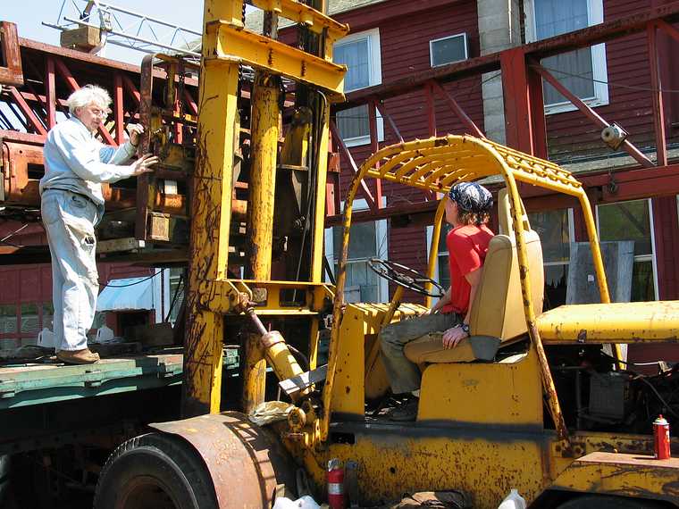 May 19, 2003 - Merrimac, Massachusetts.<br />In Bill Hanley's yard.<br />Bill directing Joe, who is operating the big fork lift.