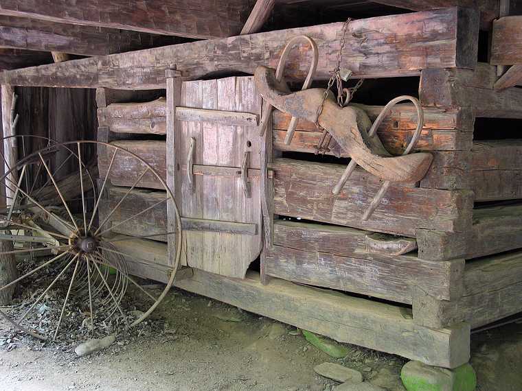 June 17, 2003 - Cades Cove, Great Smoky Mountains National Park, Tennessee.<br />Tools under cantilever barn at the Cable Mill area.