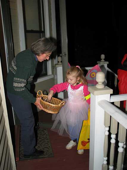 Oct 31, 2003 - Halloween, Merrimac, Massachusetts.<br />Joyce offering treats.