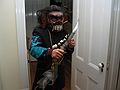 Nov 1, 2003 - Marrimac, Massachusetts.<br />At Cindia and Lance's for a pot luck supper party the day after Halloween.<br />Joyce with mask that Melody bought in Indonesia for Eric and a Morrocan knife given to us by Salvador.