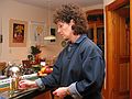 Dec 24, 2003 - Merrimac, Massachusetts.<br />John and Bonnie visiting on Christmas Eve.<br />Bonnie lighting the Hanukah menorah (candelabra).