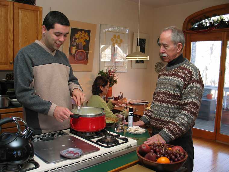 Dec 27, 2003 - Merrimac, Massachusetts.<br />Melody's 30th and Miranda's 2nd birthday celebration.<br />Sati making creme brulee, Ronnie watching, and Melody.