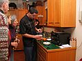 Dec 27, 2003 - Merrimac, Massachusetts.<br />Melody's 30th and Miranda's 2nd birthday celebration.<br />Ronnie, Baiba, Joyce, and Melody watching Sati caramelizing the creme brulee.