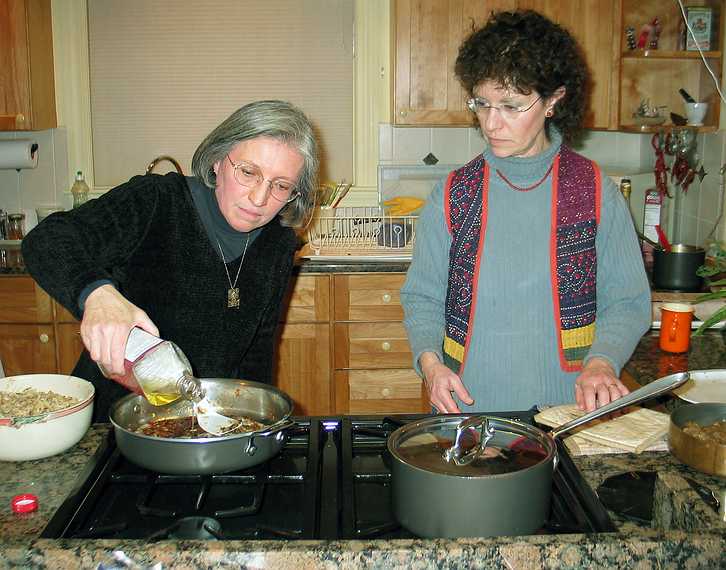 Jan 11, 2004 - Newburyport, Massachusetts.<br />At John and Bonnie's home.<br />Joyce and Bonnie preparing a rsti (Swiss potato pancake).
