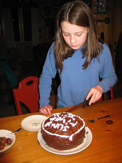 Jan 18, 2004 - Sunday River, Maine.<br />At the Cunninghams' ski lodge.<br />Lydia and her chocolate cake.