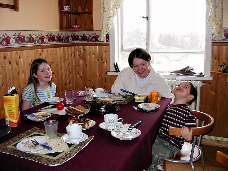 March 21, 2004 - Vogar, Iceland.<br />Dagbjrt, Inga, and Gujn enjoying Inga's birthday cake.