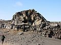 March 22, 2004 - Between Reykjanes and Hafnir on the end of Suurnes, Iceland.<br />Eric photographing a cross section of one of the rock "bubbles".