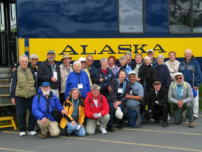 June 12, 2004 - Seward, Alaska. The whole Interhostel "Alaska, Land of the Midnight Sun" group plus the train conductor.<br />Back row: Phil, Michelle, Jim, Ken, Helen B., Helen K., Bob, Fae, Pam, Jane, Sue, Donna, Phyllis, Bill, Mary Lou, Jan, Arn.<br />Front row: Egils, Joyce, Carol, June, Joe, train conductor, Eric.