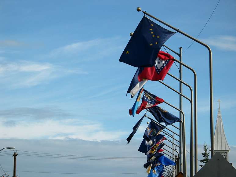 June 17, 2004 - Fairbanks, Alaska.<br />Alaska and other state flags on Cushman Street bridge over the Chena River.