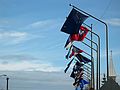 June 17, 2004 - Fairbanks, Alaska.<br />Alaska and other state flags on Cushman Street bridge over the Chena River.