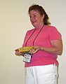 June 18, 2004 - Fort Knox Gold Mine near Fairbanks, Alaska.<br />Pam Johnson being photographed with a 21 lb. bar of gold worth more than $100,000.
