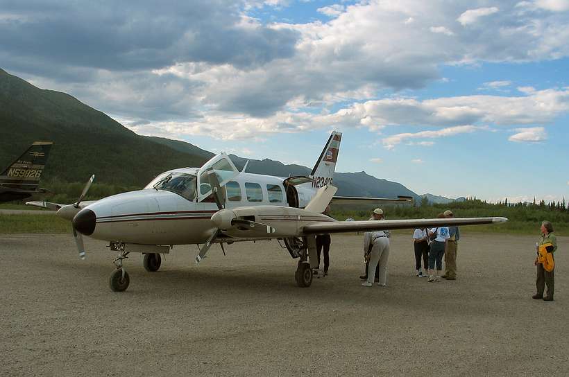 June 20, 2004 - Coldfoot, Alaska (55 miles north of the Arctic Circle).<br />Joyce admiring the plane we flew here.