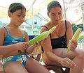 August 2, 2004 - Lawrence, Massachusetts.<br />Family get-together to see Melody, who was visiting from California.<br />Arianna and Melody shucking corn.