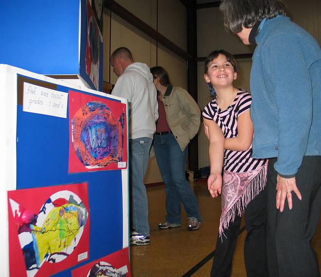 Feb. 13, 2005 - South Hampton, New Hampshire.<br />Arianna's and Marissa's school art show.<br />Arianna showing Joyce some of her art work.