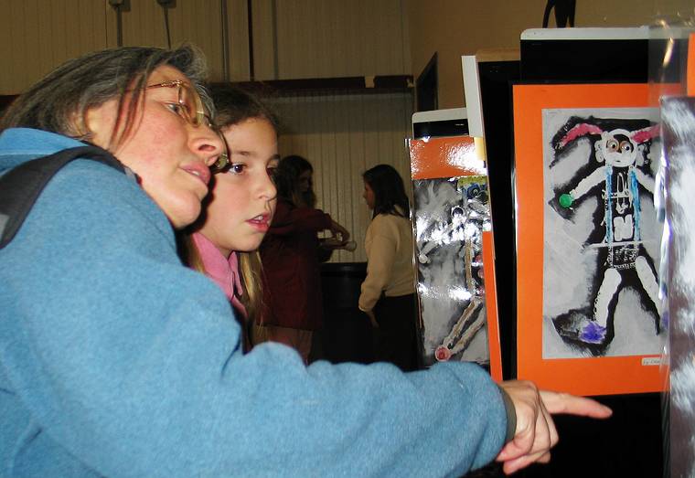 Feb. 13, 2005 - South Hampton, New Hampshire.<br />Arianna's and Marissa's school art show.<br />Joyce commenting on Marissa's art.