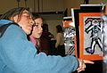 Feb. 13, 2005 - South Hampton, New Hampshire.<br />Arianna's and Marissa's school art show.<br />Joyce commenting on Marissa's art.