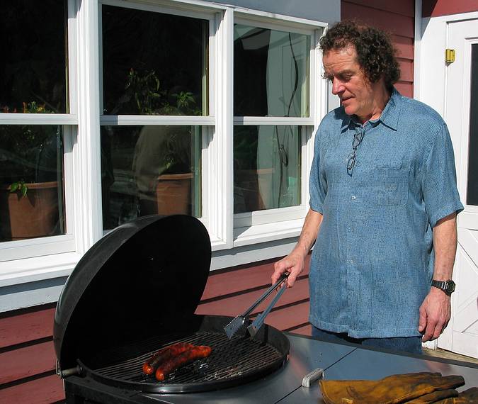 March 27, 2005 - Tewksbury, Massachusetts.<br />Easter Dinner at Paul and Norma's.<br />Paul grilling some Portugese sausage for an appetizer.