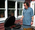 March 27, 2005 - Tewksbury, Massachusetts.<br />Easter Dinner at Paul and Norma's.<br />Paul grilling some Portugese sausage for an appetizer.