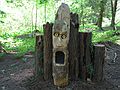June 5, 2005 - Maudslay State Park, Newburyport, Massachusetts.<br />Outdoor Sculpture Show - installation day 2.<br />Gregory M. Novakowski's "The Silent Scream". Carved wood log, segments of tree trunk.