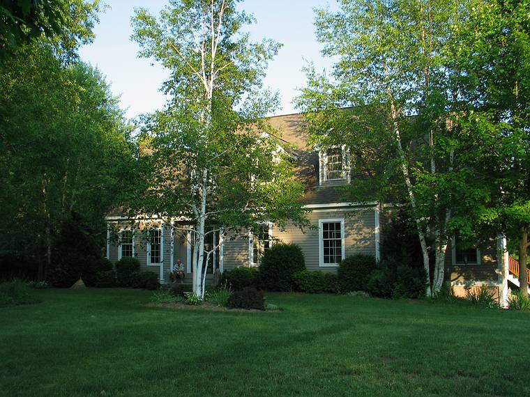 June 21 - AtTom and Kim's in South Hampton, New Hampshire.<br />Tom sitting on the front step of his house.
