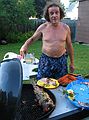 July 4, 2005 - Lawrence, Massachusetts.<br />Celebrating the 4th at Memere Marie's pool.<br />Paul, the chef, with grilled salmon.