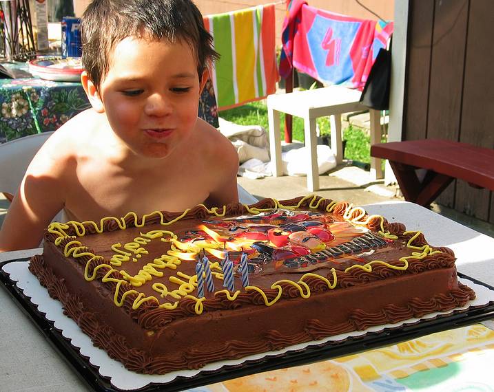 July 10, 2005 - At Marie's in Lawrence, Massachusetts.<br />Gujns 5th birthday celebration.<br />Gujn blowing out 5 candles.