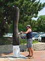 July 13, 2005 - Somerby's Landing, Newburyport, Massachusetts.<br />Richard Aliberti taking a chainsaw to his sculpture to uninstall it.