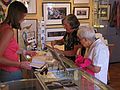 July 15, 2005 - Newburyport, Massachusetts.<br />Joyce and Marie buying gifts for Baiba.<br />John Geesink's photos on the wall.