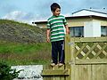 August 5, 2005 - Vogar, Iceland.<br />Guðjón atop new fence istalled by his father Eric.