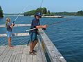 August 9, 2005 - Hermit Island, Small Point, Maine.<br />Marissa and Paul fishing off dock on east side of Hermit Island.