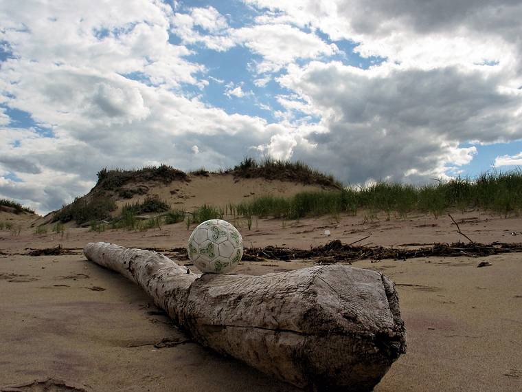 August 23, 2005 - Parker River National Wildlife Refuge, Plum Island, Massachusetts.<br />John and I found this soccer ball.<br />After I took this photo, we kicked it for a while down the beach.