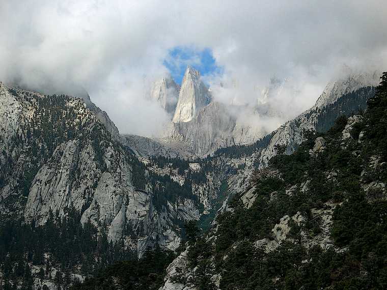 August 16, 2005 - Whitney Portal Road out of Lone Pine, California.<br />Keeler Needle with Mt. Whitney on the clouds just to the right.