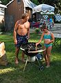 September 3, 2005 - Lawrence, Massachusetts.<br />Another family gathering at Memere Marie's pool on a hot summer day.<br />Paul teaching Arianna how to light the charcoal.