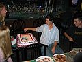 October 2, 2005 - Tiki Lau II Restaurant, Amesbury, Massachusetts.<br />T.J.'s 18th birthday celebration<br />T.J. casually cutting the birthday cake.