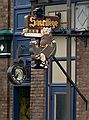 April 15, 2006 - Quebec City, Quebec, Canada.<br />The Sacrilege Bar sign on Rue St-Jean across the street from Saint-Jean-Baptiste Church.