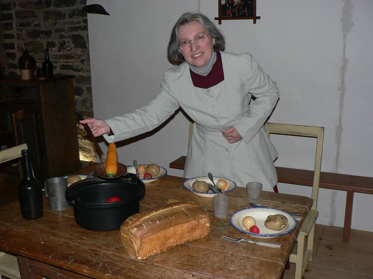 April 16, 2006 - Quebec City, Quebec, Canada.<br />Centre d'interprtation de Place-Royale.<br />Joyce serving soup.