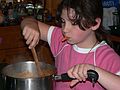 May 13, 2006 - Merrimac, Massachusetts.<br />Arianna cooking and smoking a carrot.
